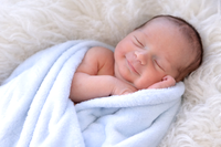 Serene newborn resting in soft comfort
